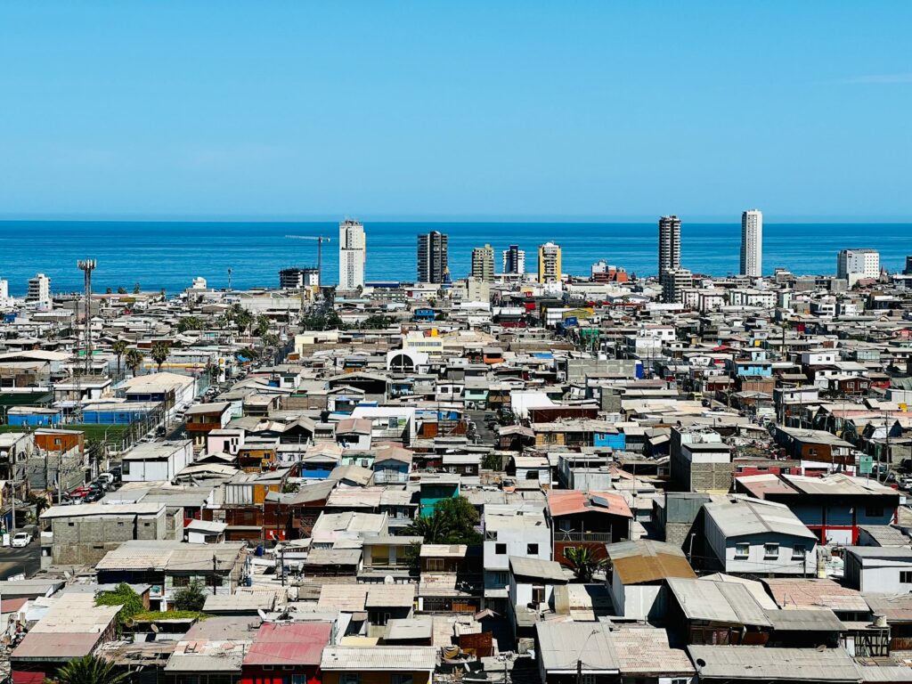 a view of a city with a body of water in the background