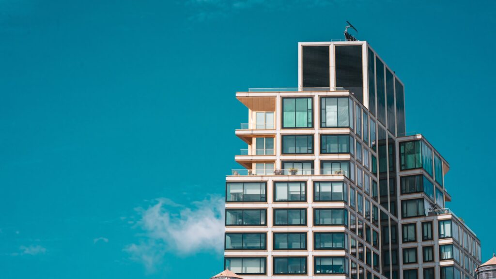 a tall building with a bird on top of it